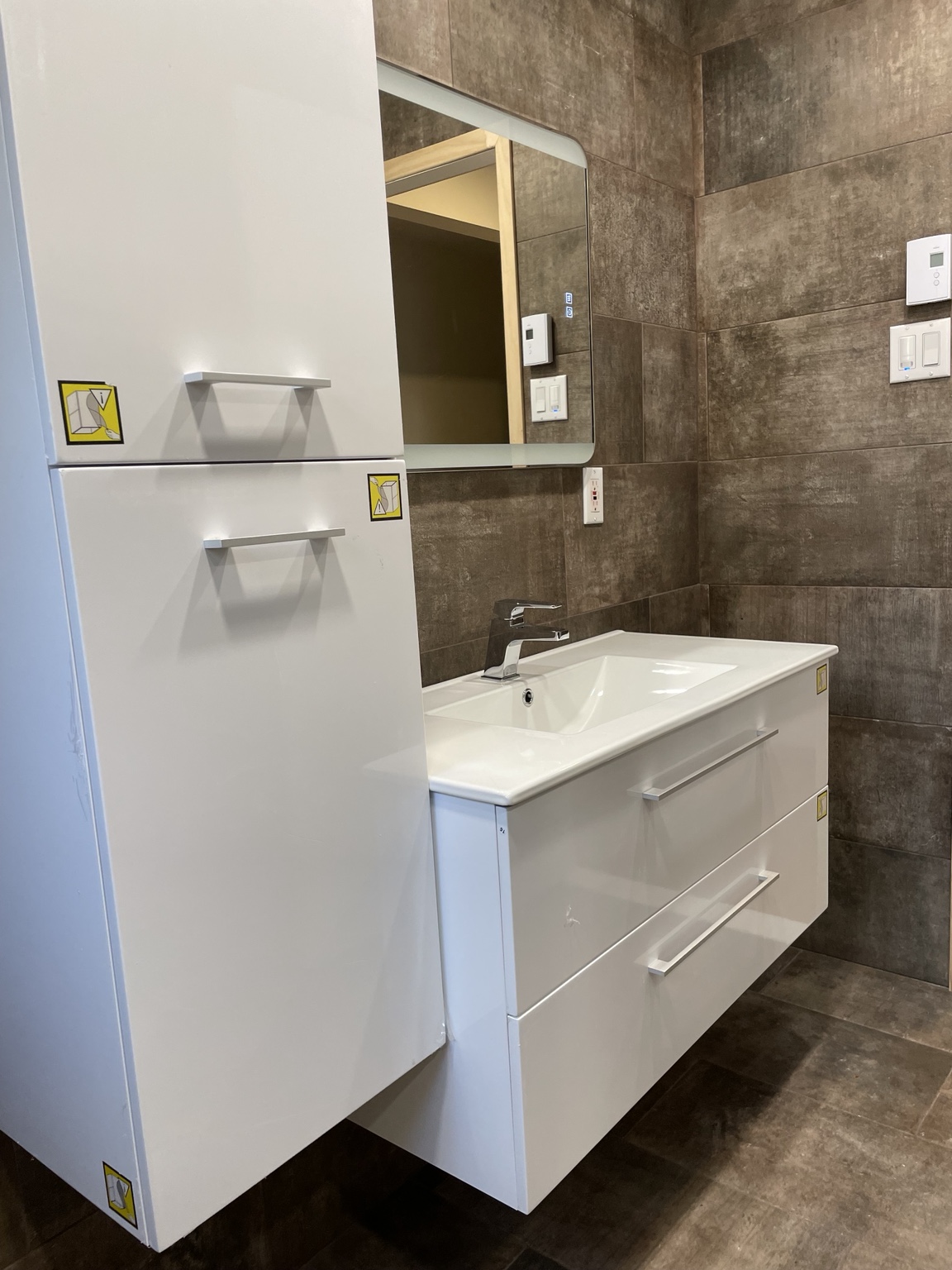 Modern white bathroom vanity after renovation